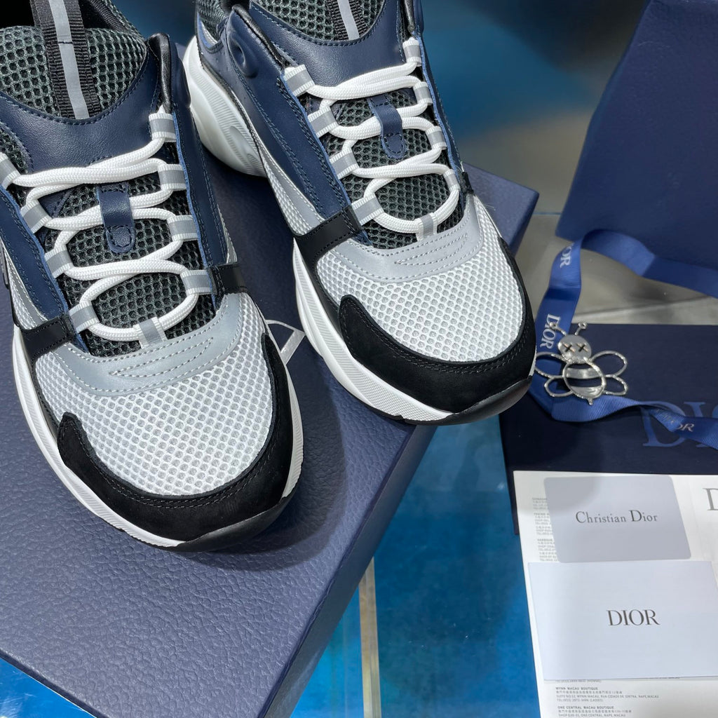 Close-up Dior sneakers with lace front, mesh upper, and chunky tread sole