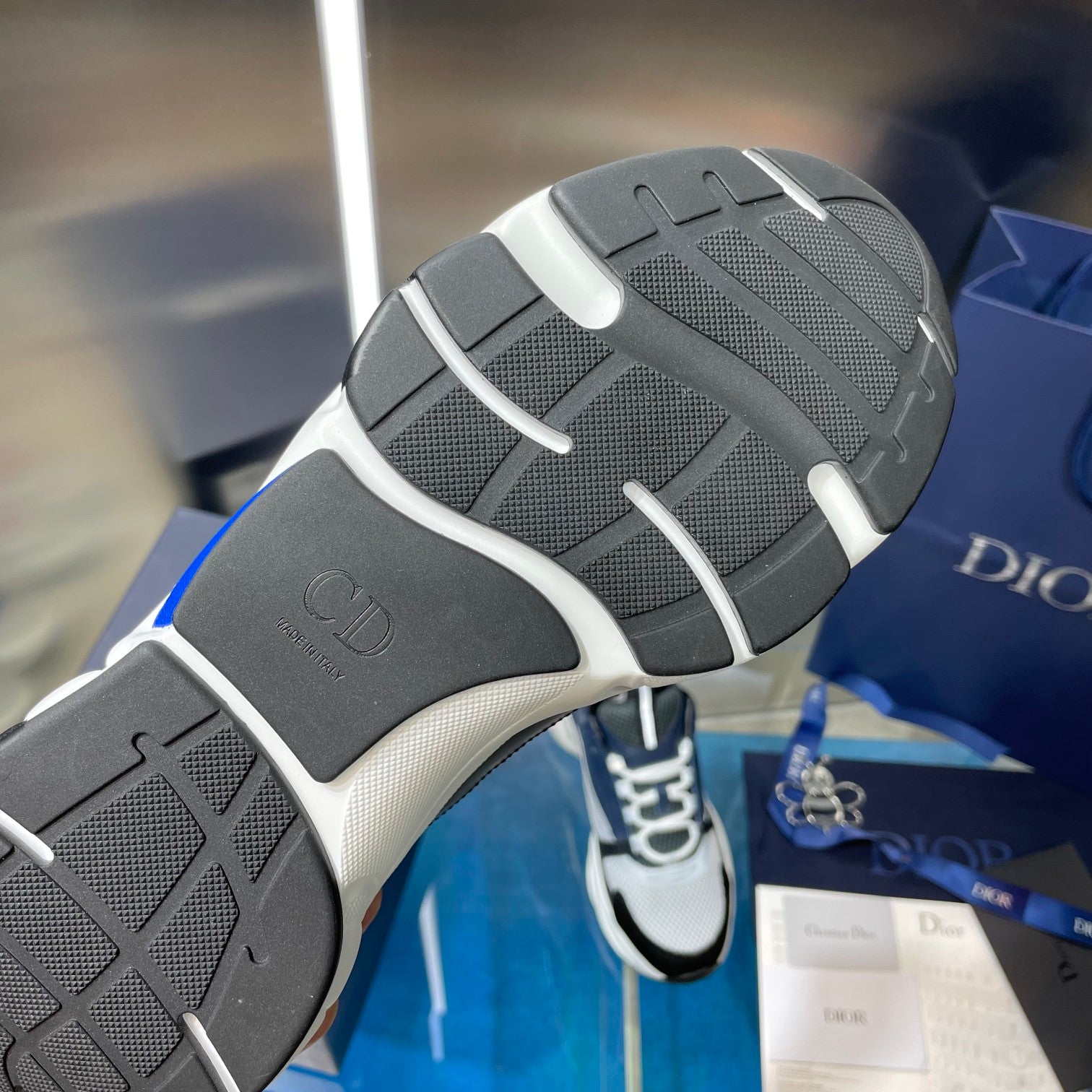 Rubber outsole of Dior sneakers with textured tread and curved sidewall