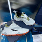 Unisex sneakers in white with neon green accents, black tongue lining, lace-up