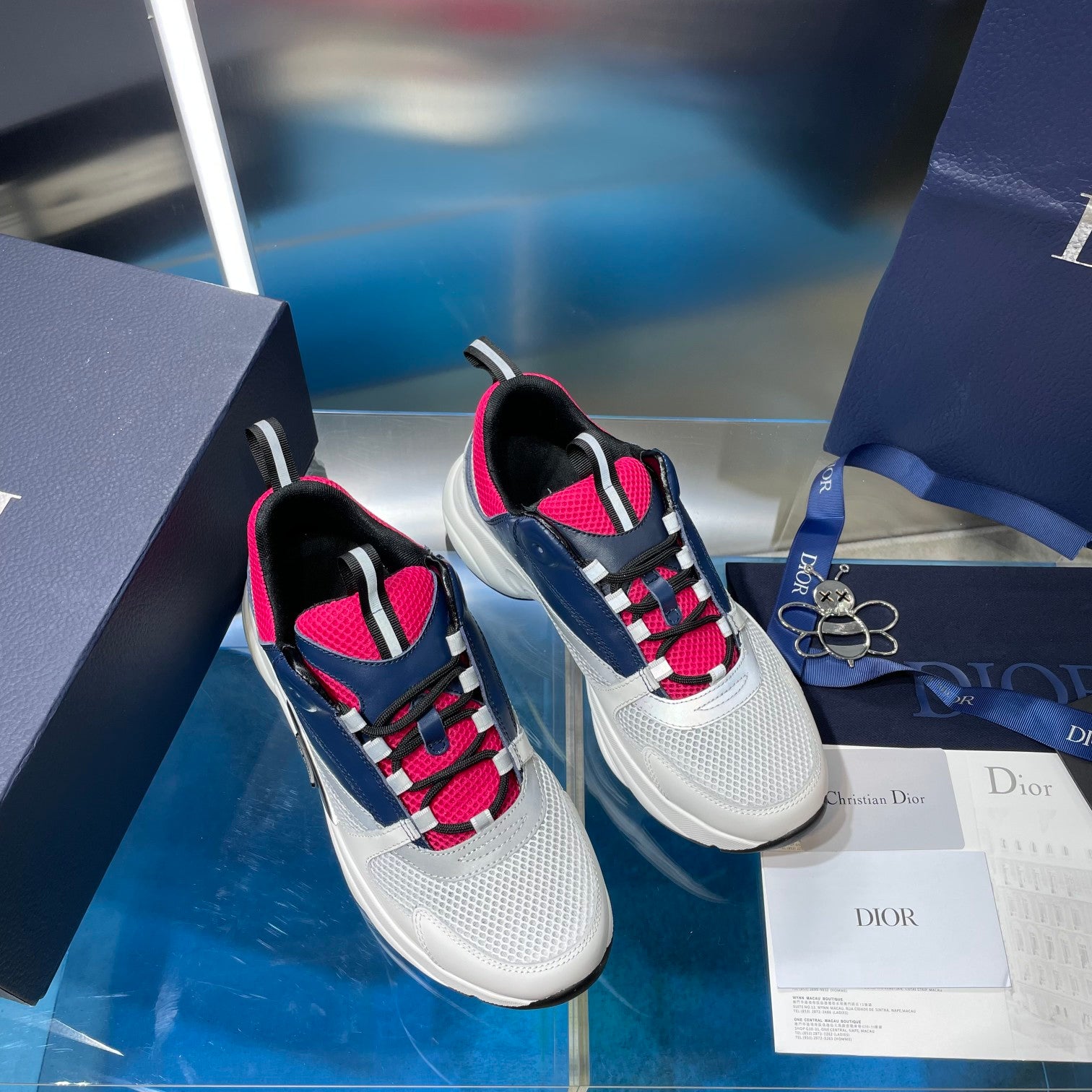 Two-tone lace-up sneakers in white and navy with bright pink trim