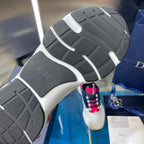 Shoe outsole tread in dark gray and white with molded traction grips