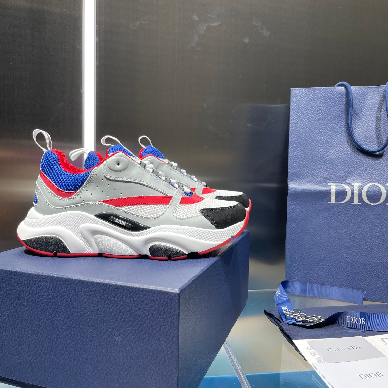 Dior unisex sneakers, white mesh with blue and red accents, lace-up design