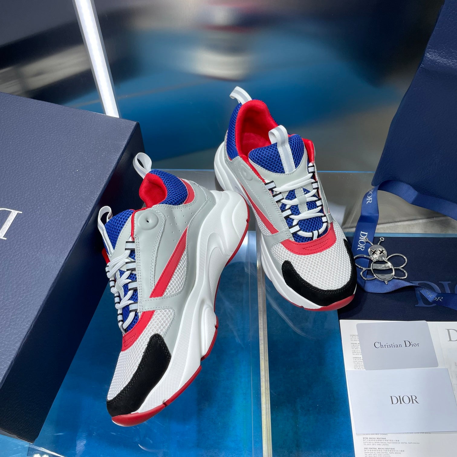 Dior unisex sneakers, white and blue upper with red heel trim, lace-up look