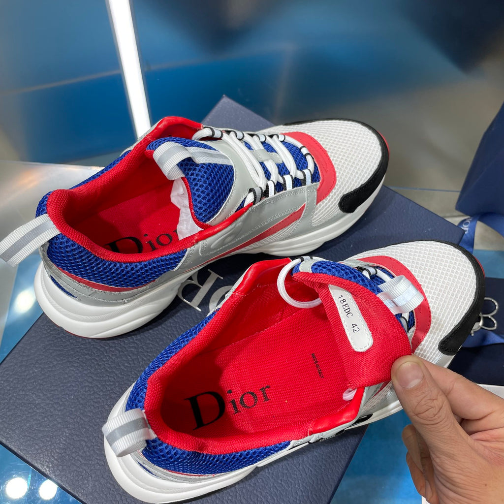 Dior unisex sneakers, close-up of red tongue lining with Dior lettering