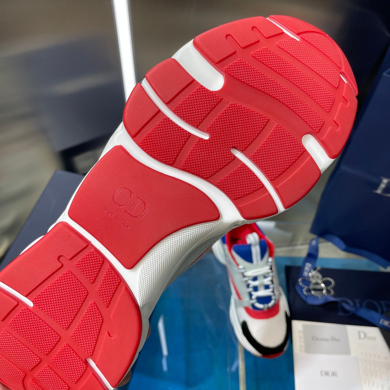 Dior unisex sneakers outsole, red textured tread with white edges