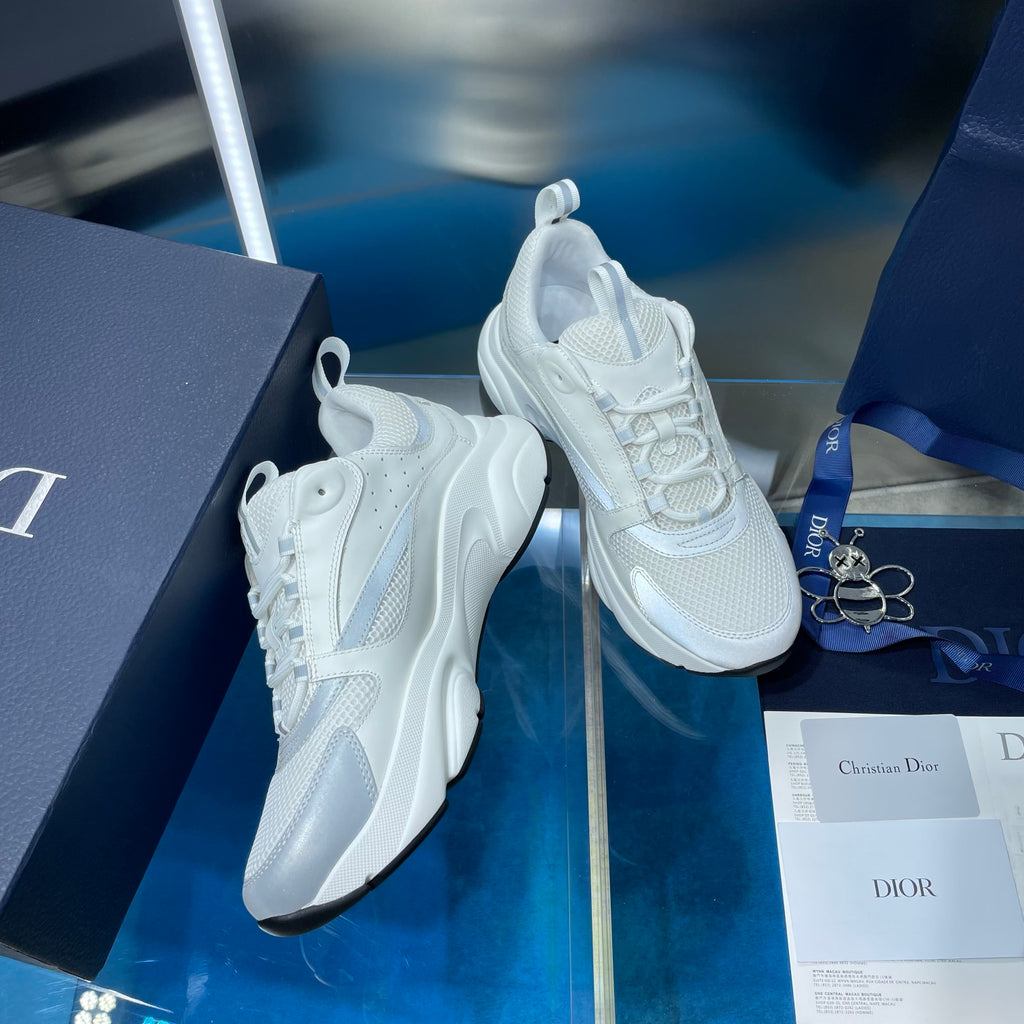 White lace-up sneakers showing side profile and thick rubber sole
