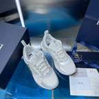 Pair of white lace-up sneakers with raised sole and padded tongue