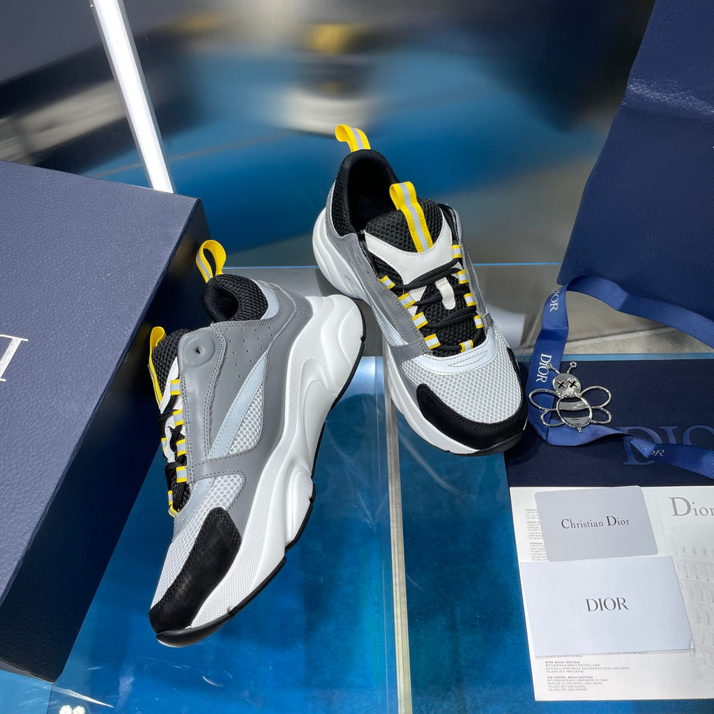 Unisex chunky sneakers, gray and black with yellow-striped laces and thick sole
