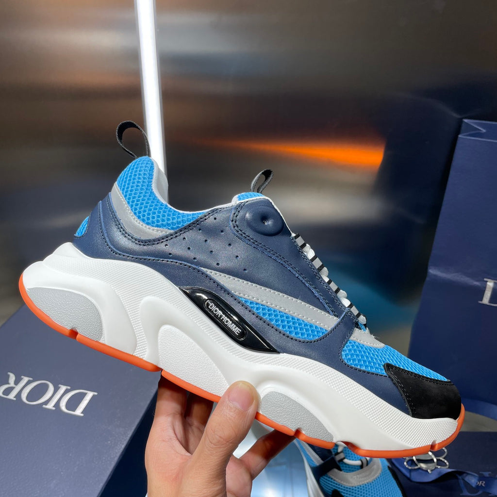 Dior unisex athletic sneakers, blue and navy upper with white sole and orange edge