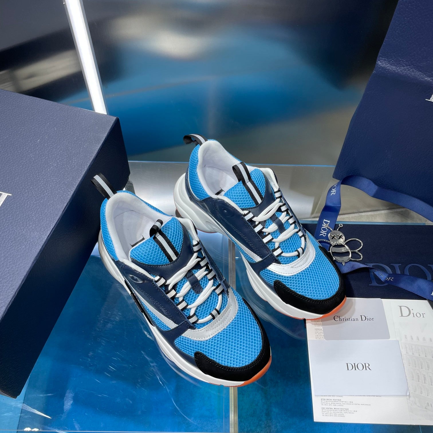 Dior unisex sneakers pair, blue and navy with white sole, lace-up design