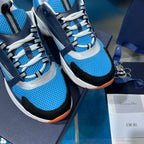 Dior unisex sneakers close-up, blue mesh, navy overlays, white laces