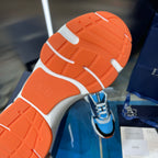 Dior unisex sneakers outsole view, orange tread with white sidewall