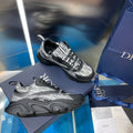 High-top sneakers with black rubber sole and silver patterned panels, lace-up design