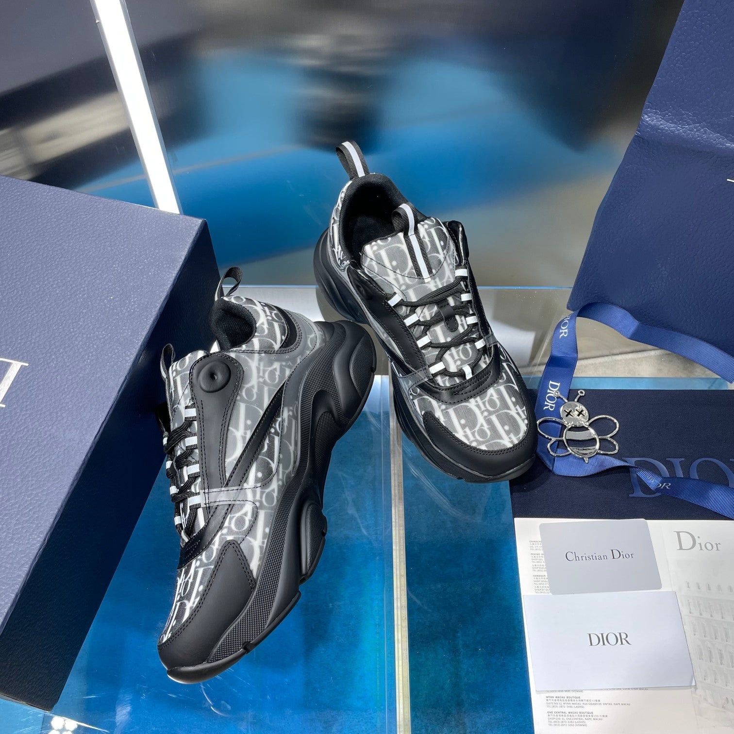 Lace-up sneakers with silver logo-print toe and dark padded collar, chunky sole