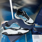 Dior unisex sneakers in white, black, and light blue with chunky sole
