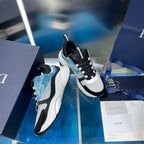Dior unisex sneakers shown from side: white sole, black upper, light blue trim