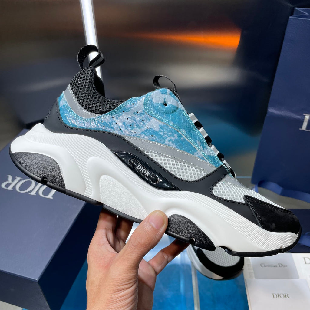 Dior unisex sneaker close-up: black and light blue upper with thick white sole