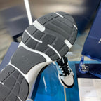 Dior unisex sneaker outsole with dark tread and white edge detailing