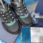 Close-up of black mesh lace-up sneakers with teal accent and padded laces
