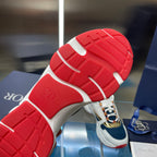 Dior unisex sneaker outsole, red tread with white heel and navy upper