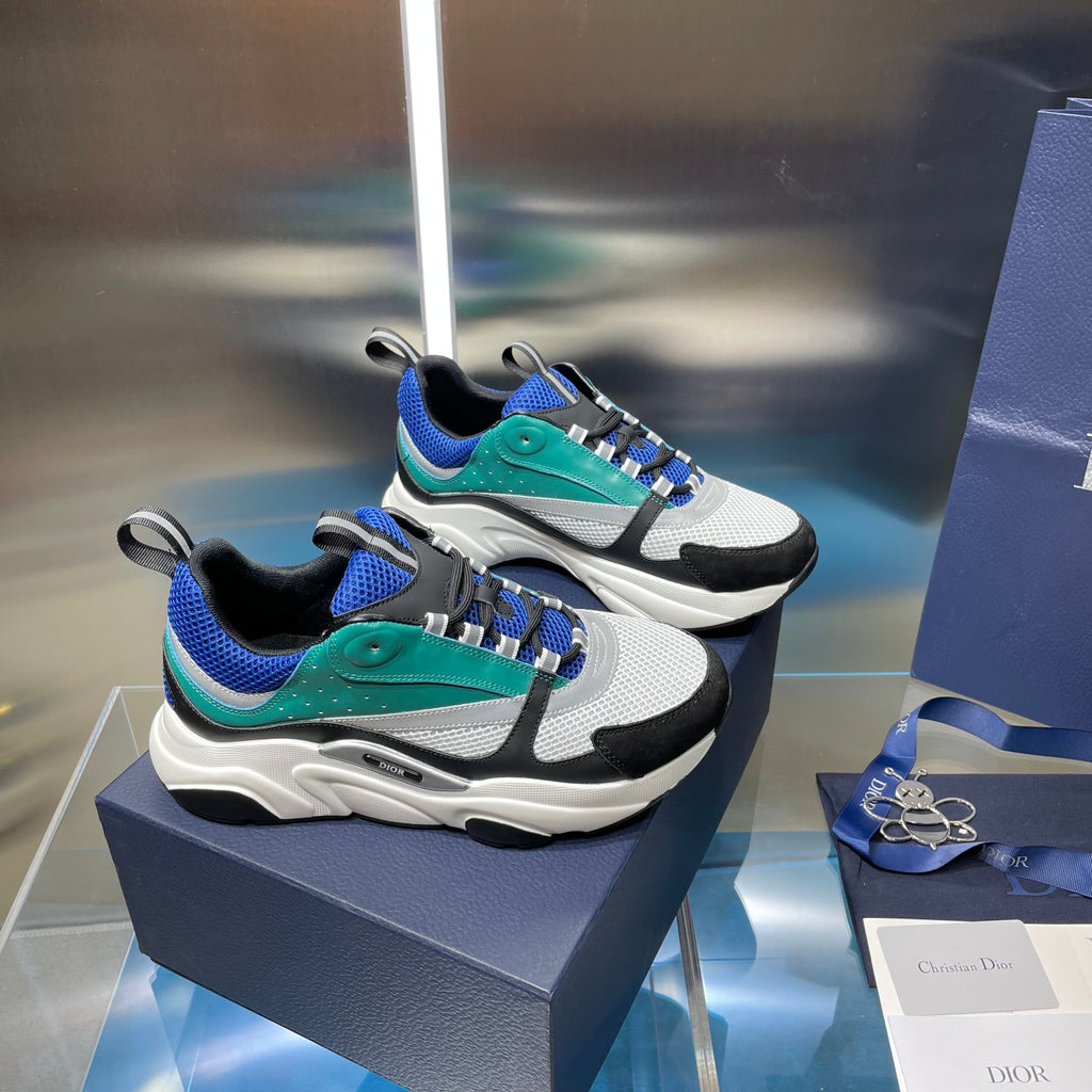 Dior unisex sneakers pair: teal and blue upper with black accents and white sole