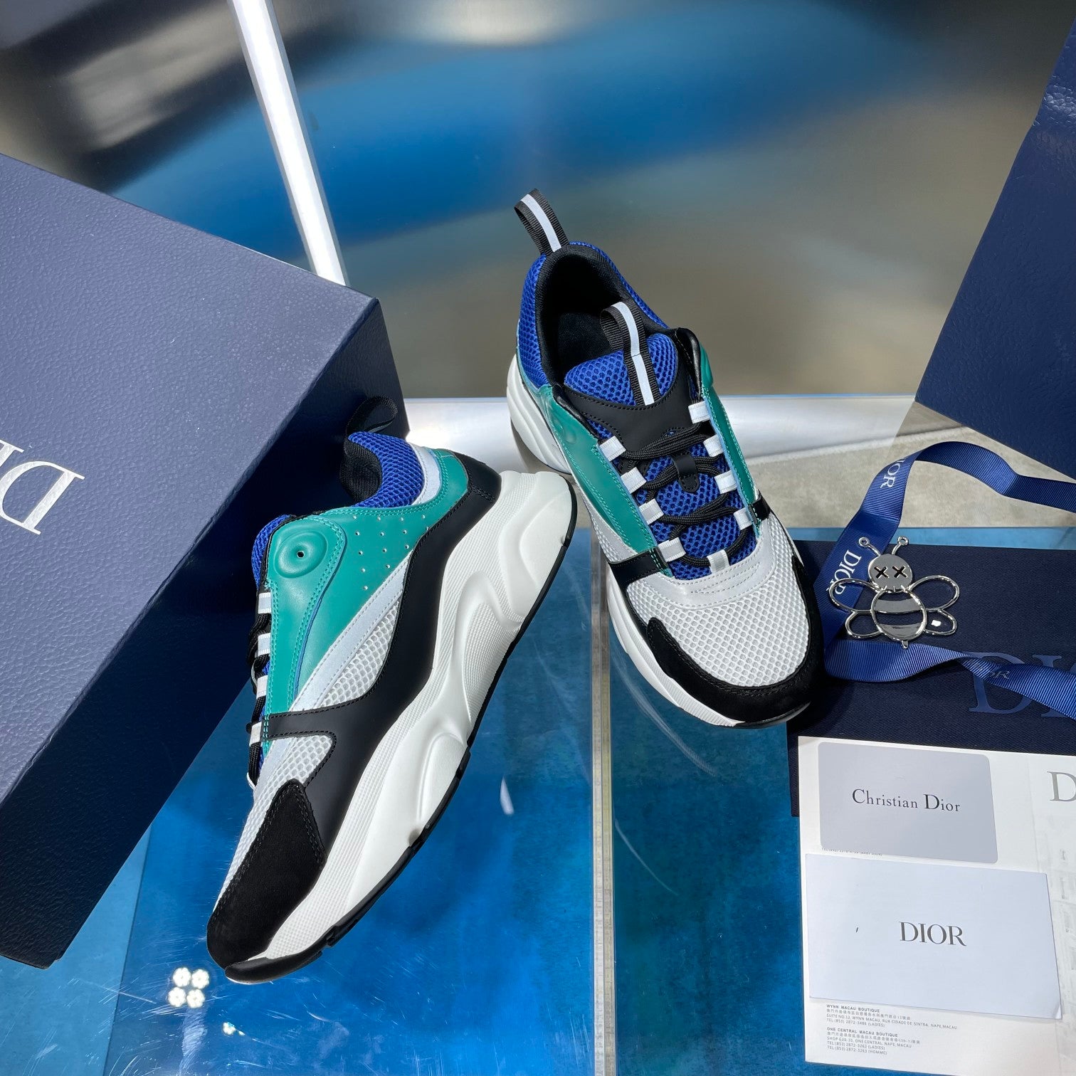 Dior unisex sneakers with teal side panel, blue knit, black toe, white sole