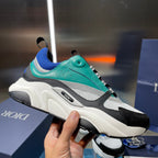 Dior unisex sneaker, teal upper with blue knit, black toe cap, white chunky sole