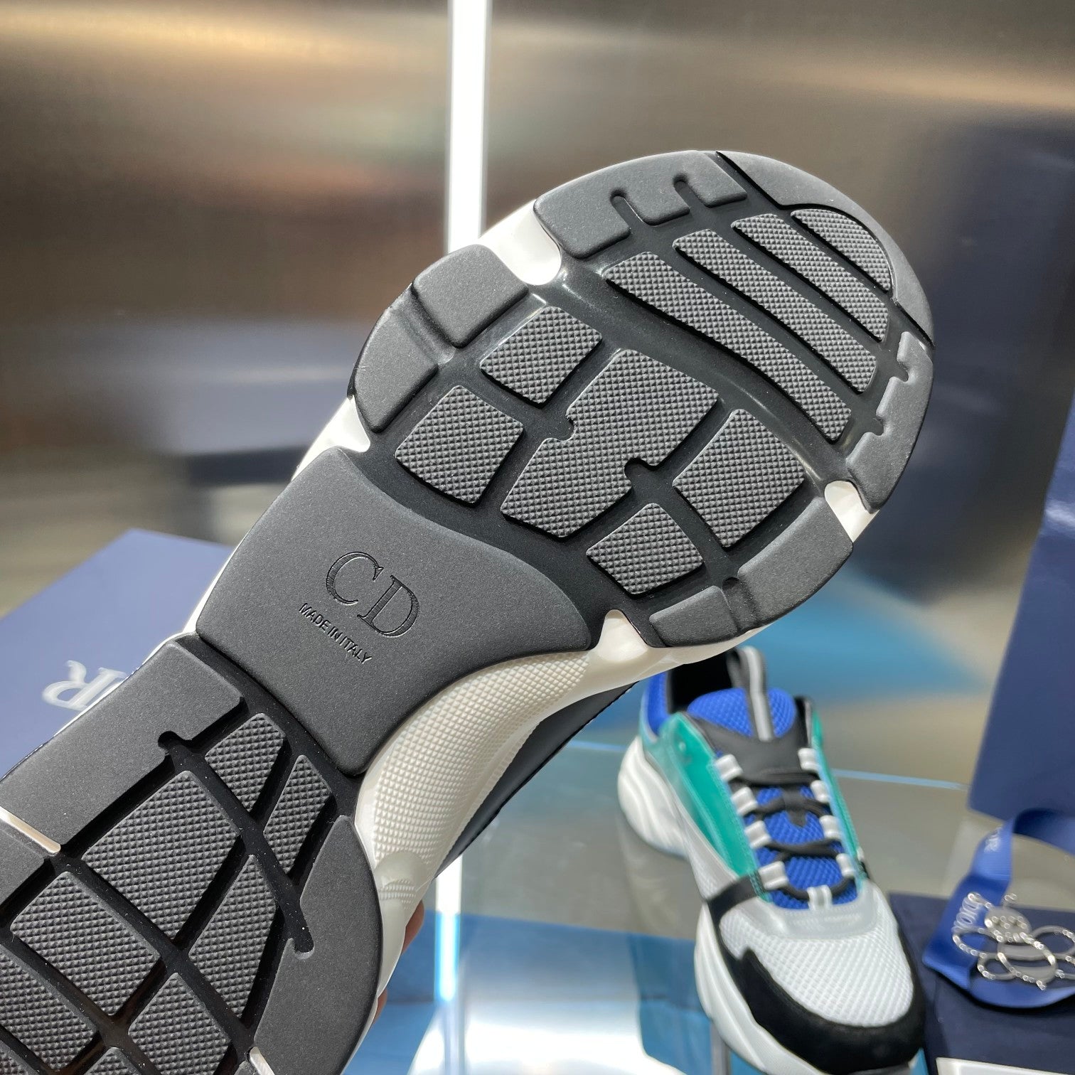 Dior sneaker outsole tread with CD logo on dark rubber