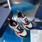 Two white and black lace-up sneakers with red stripe accents and chunky soles.