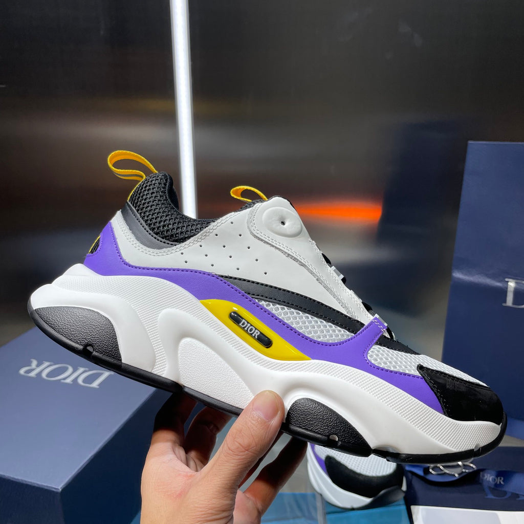 Dior chunky runner sneaker, white sole with black and purple panels, yellow lace accents