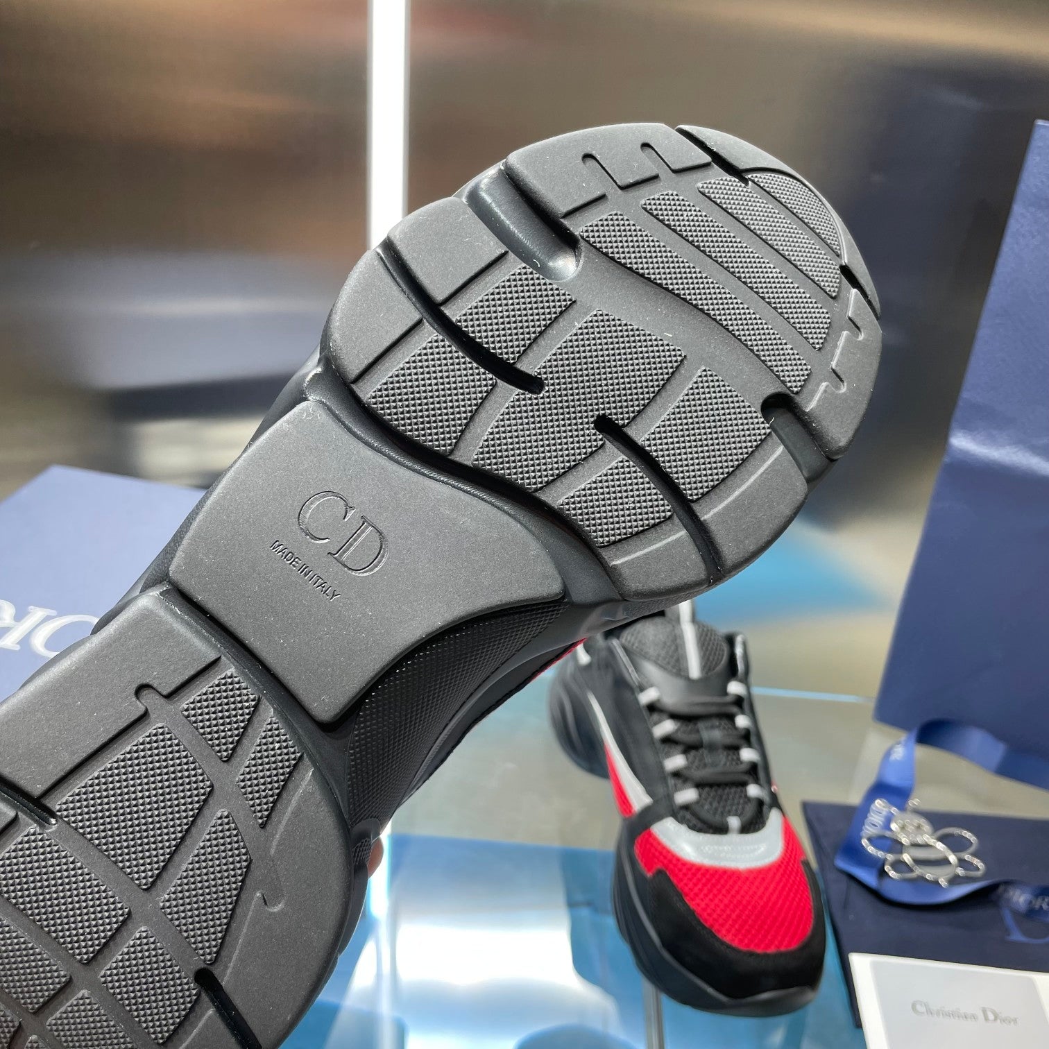 Unisex Dior sneaker outsole and heel, textured tread on dark rubber sole
