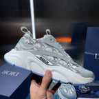 Dior unisex sneakers with Dior Oblique pattern on light blue-gray leather and white sole