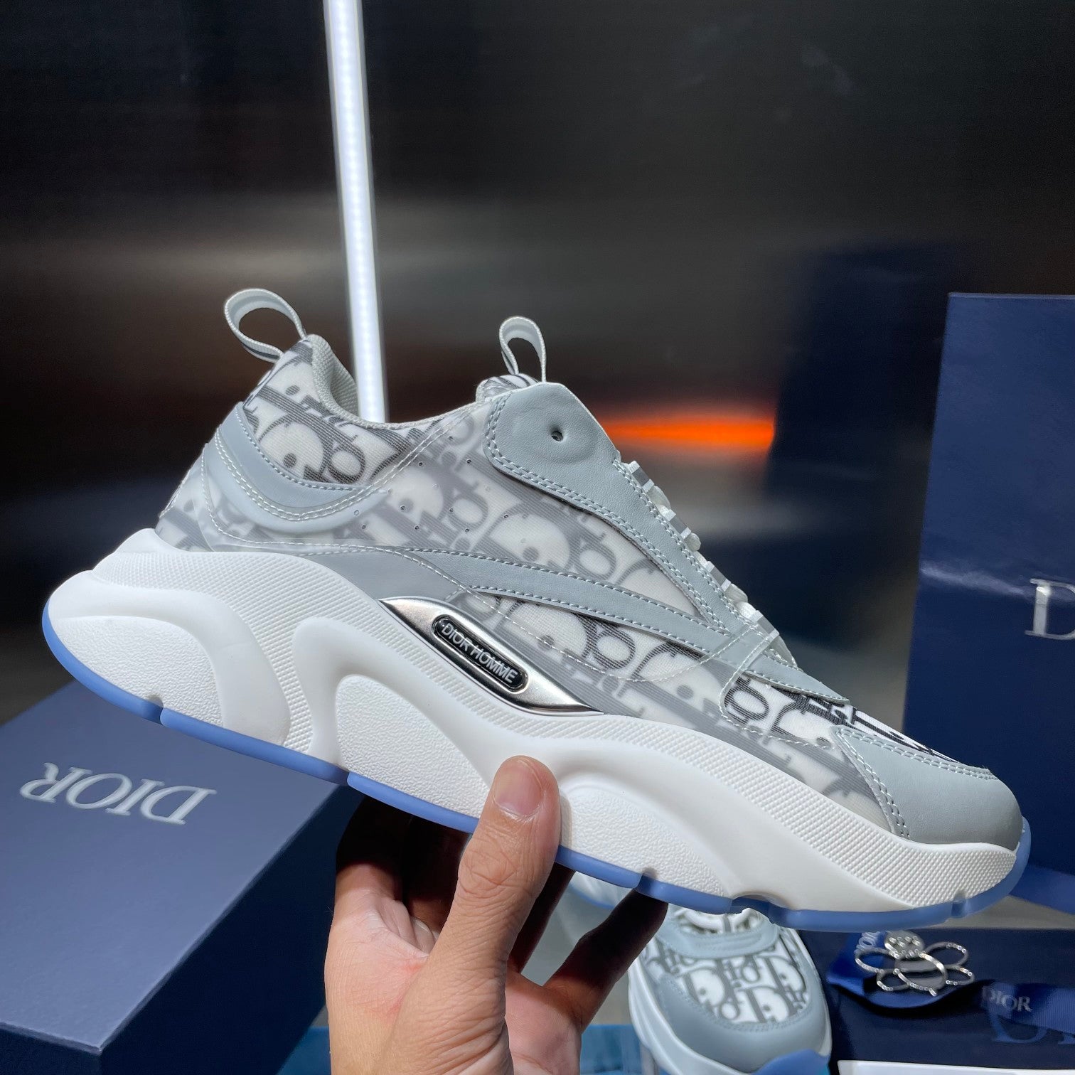 Dior unisex sneakers with Dior Oblique pattern on light blue-gray leather and white sole