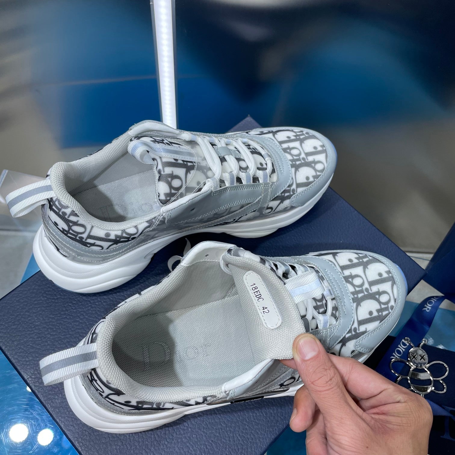 Dior unisex sneakers with Dior Oblique print and light blue-gray uppers, white sole