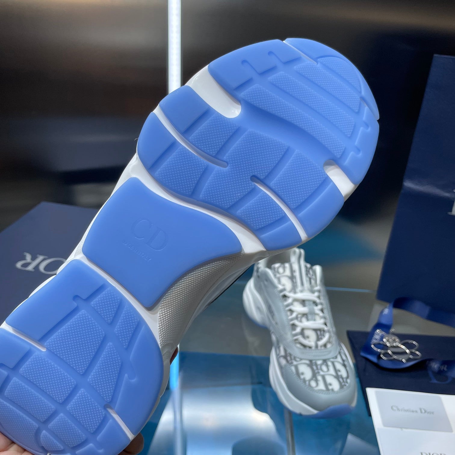 Dior unisex sneaker outsole in blue and white with molded traction pattern