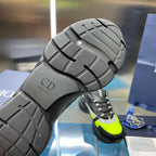 Rubber outsole of chunky sneakers with textured tread and CD logo mark.