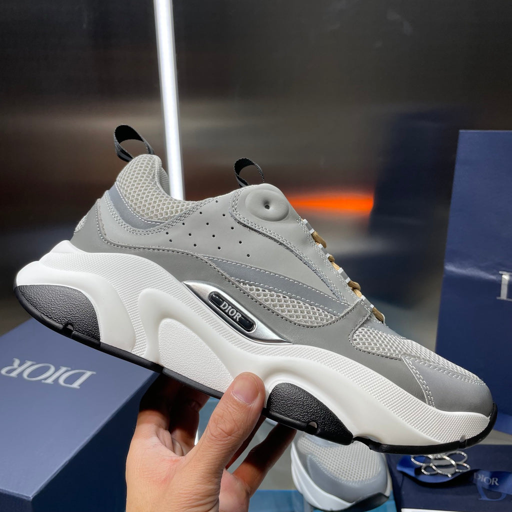 Unisex sneakers side view, light gray with black sole and gold lace trim