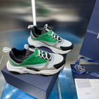 White, green, and black lace-up sneakers with chunky sole and sporty tread