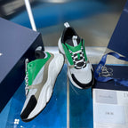 Pair of green and white lace-up sneakers with black heel and side panels