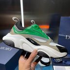 Green leather and mesh lace-up sneaker with white chunky sole and black accents