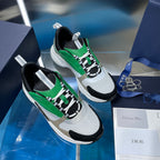 White and green lace-up sneakers with black side panels and gray heel tabs