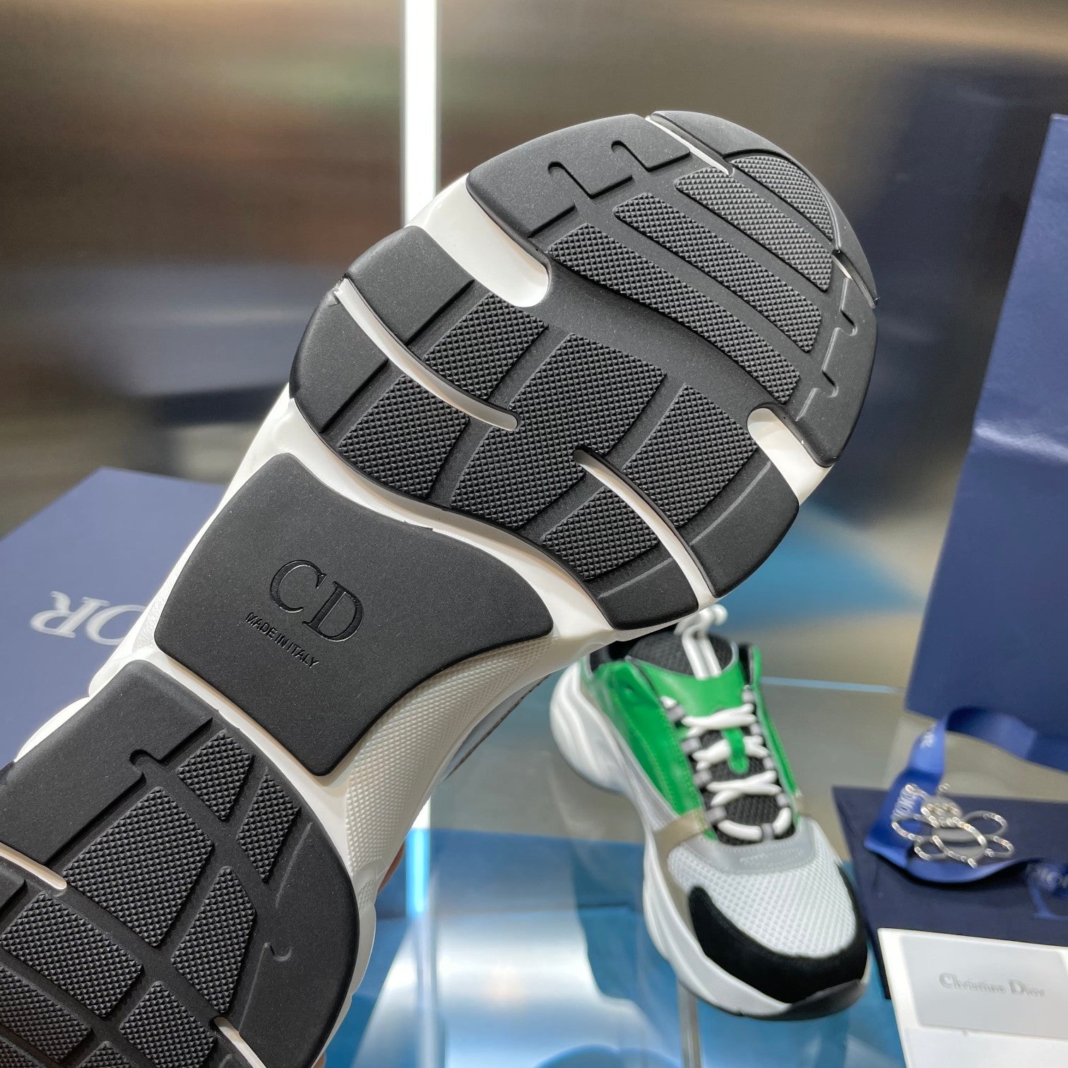 Dior sneaker outsole with black rubber tread and white midsole