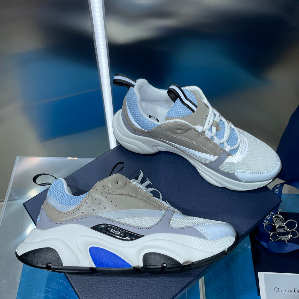 Unisex low-top sneakers in light blue with beige panels and blue accents