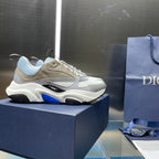 Unisex low-top sneakers on display with light blue and beige upper
