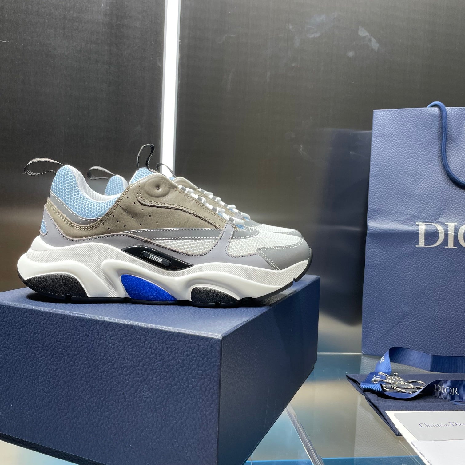 Unisex low-top sneakers on display with light blue and beige upper