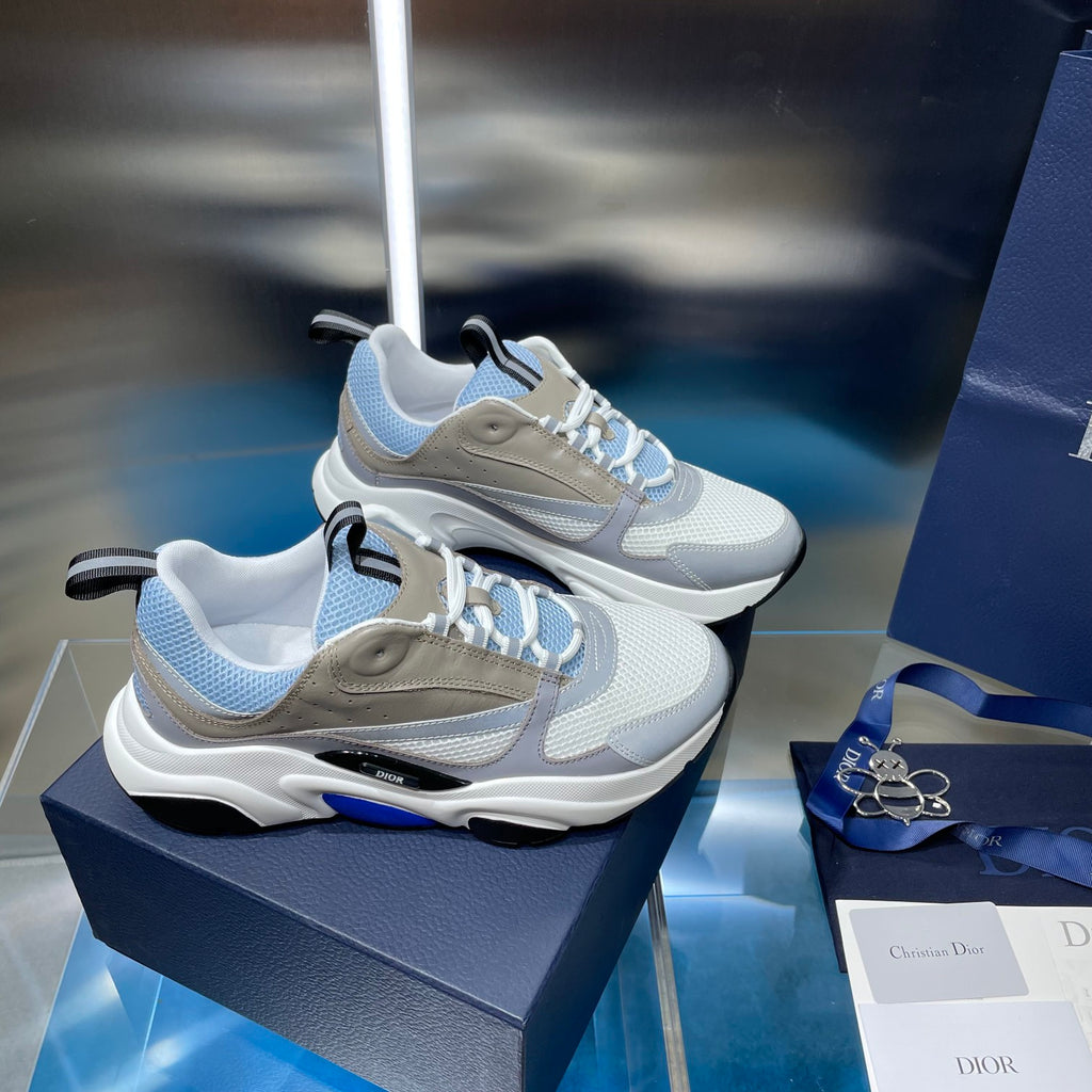 Unisex low-top sneakers pair in light blue with beige overlays and blue details