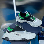 Dior unisex sneakers, white mesh with black panels and green accents, chunky sole
