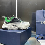 Dior unisex sneakers on box, white upper with black toe and green-striped laces