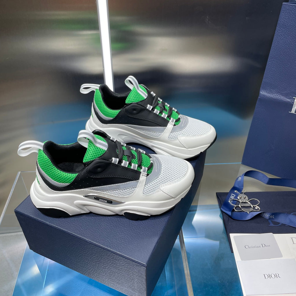 Dior unisex sneakers pair, white with black sides and bright green lace detail
