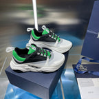 Dior unisex sneakers pair, white with black sides and bright green lace detail